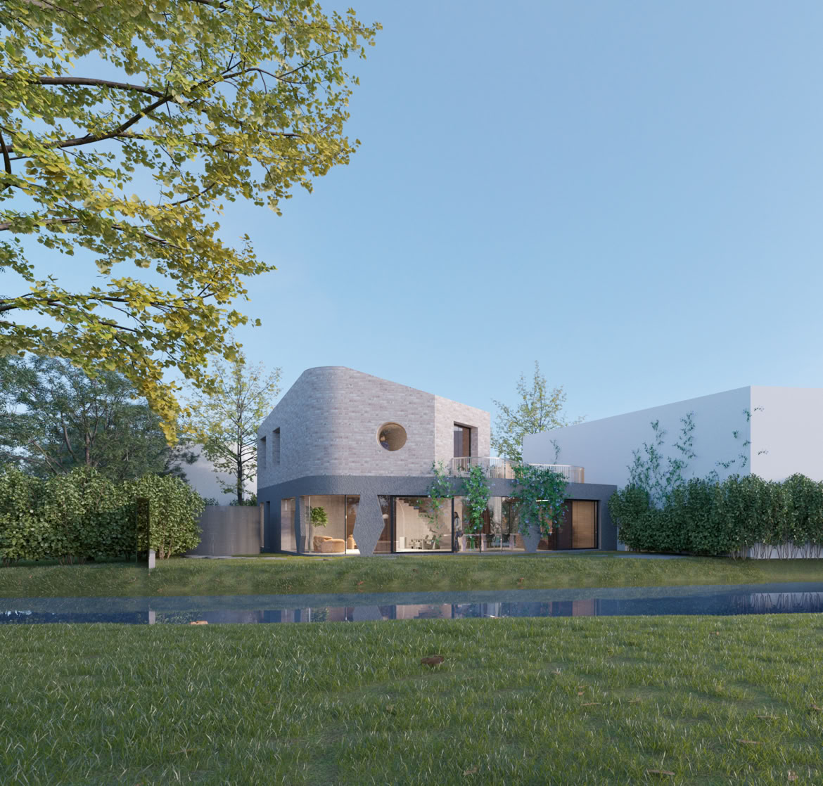 Riverfront elevation featuring natural materials and harmonious integration into the landscape.