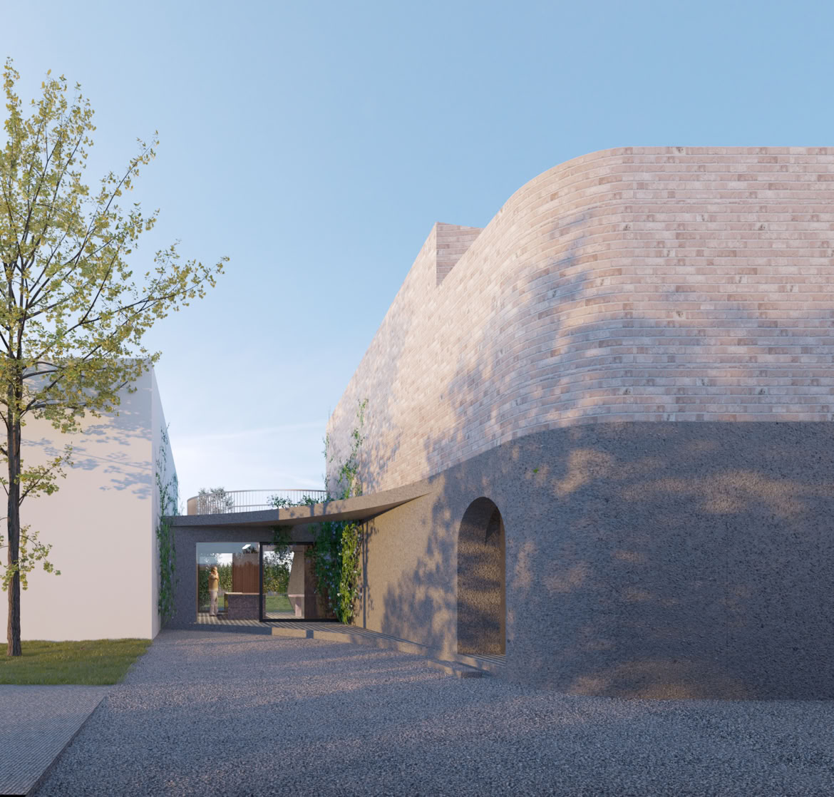 Frontal view of the building with irregular geometry in dialogue with the surrounding vegetation.