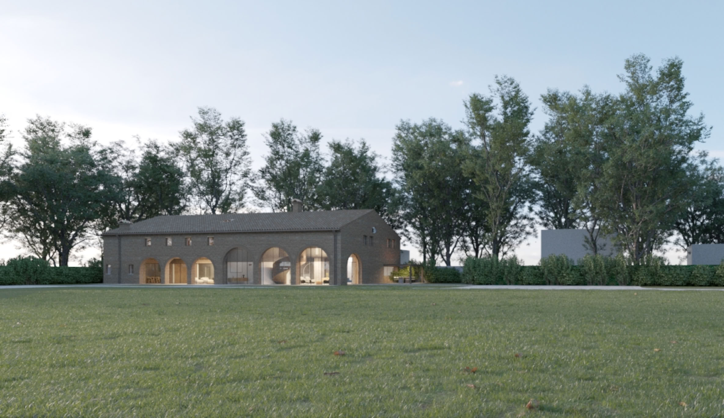 Panoramic view of the luxury contemporary rural villa immersed in lush greenery, perfectly blending architecture and landscape.