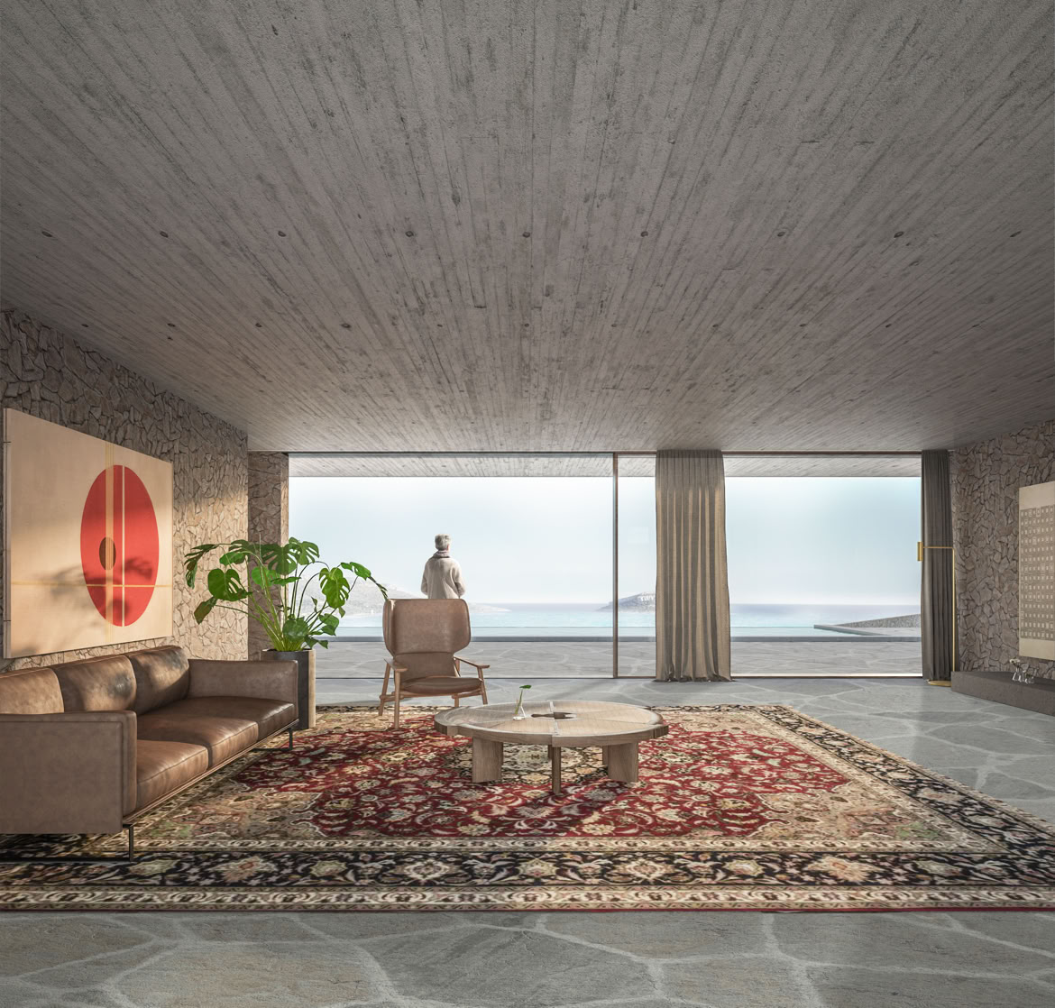 Zona giorno open-space con cucina e sala da pranzo integrate, progettata per massimizzare la luce naturale e il rapporto con il giardino e il mare.
