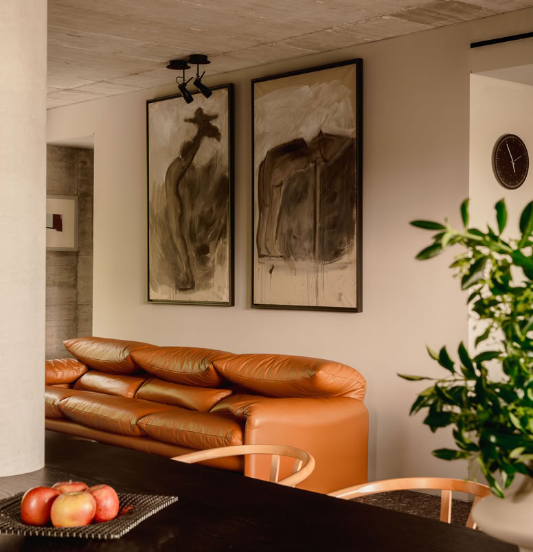 Living room view of a brutalist house in the Province of Padua, designed by MIDE architetti.