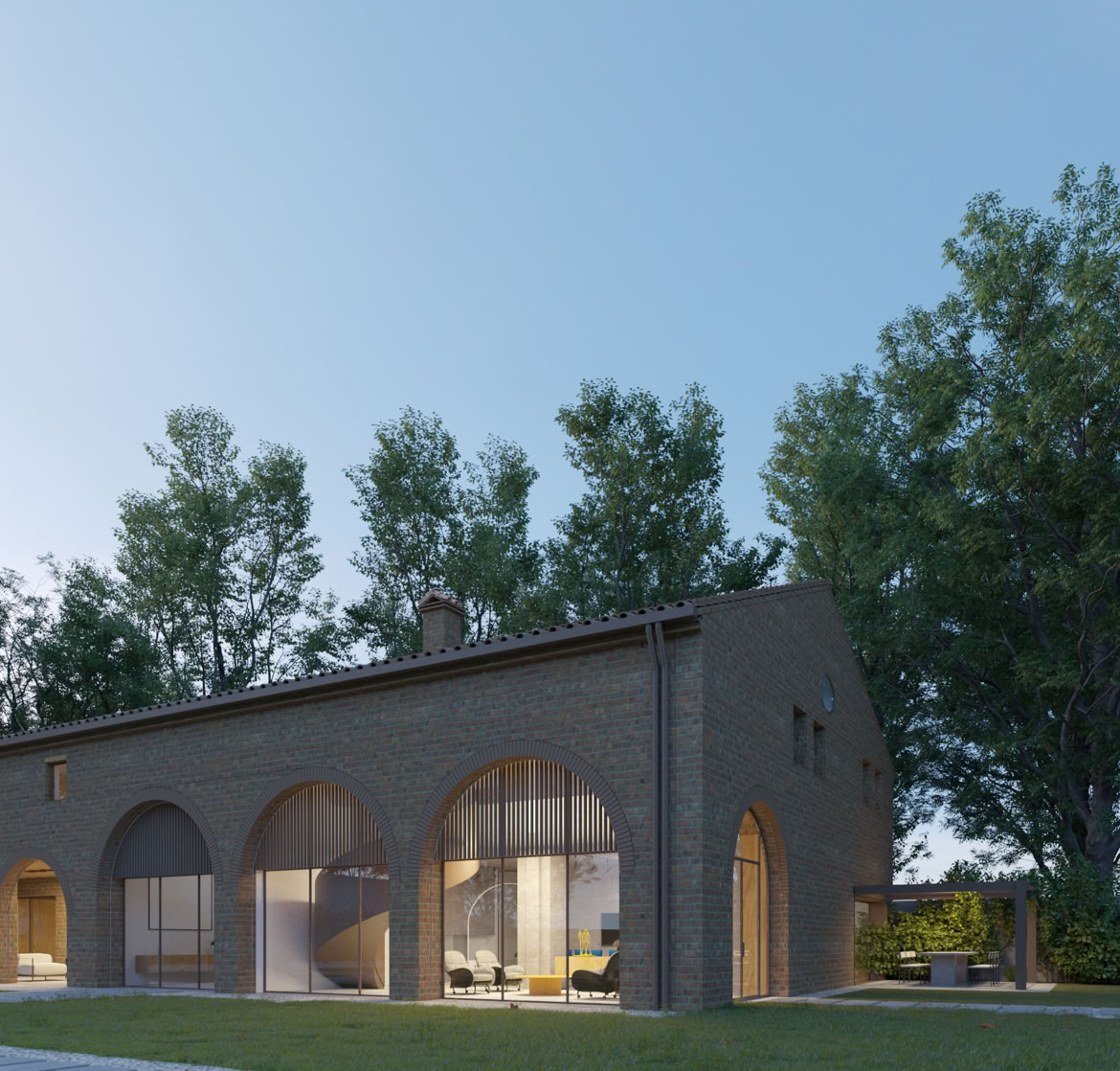 Exposed brick façade of the restored Napoleonic-era farmhouse by MIDE Architetti, combining historic charm and luxury contemporary design.