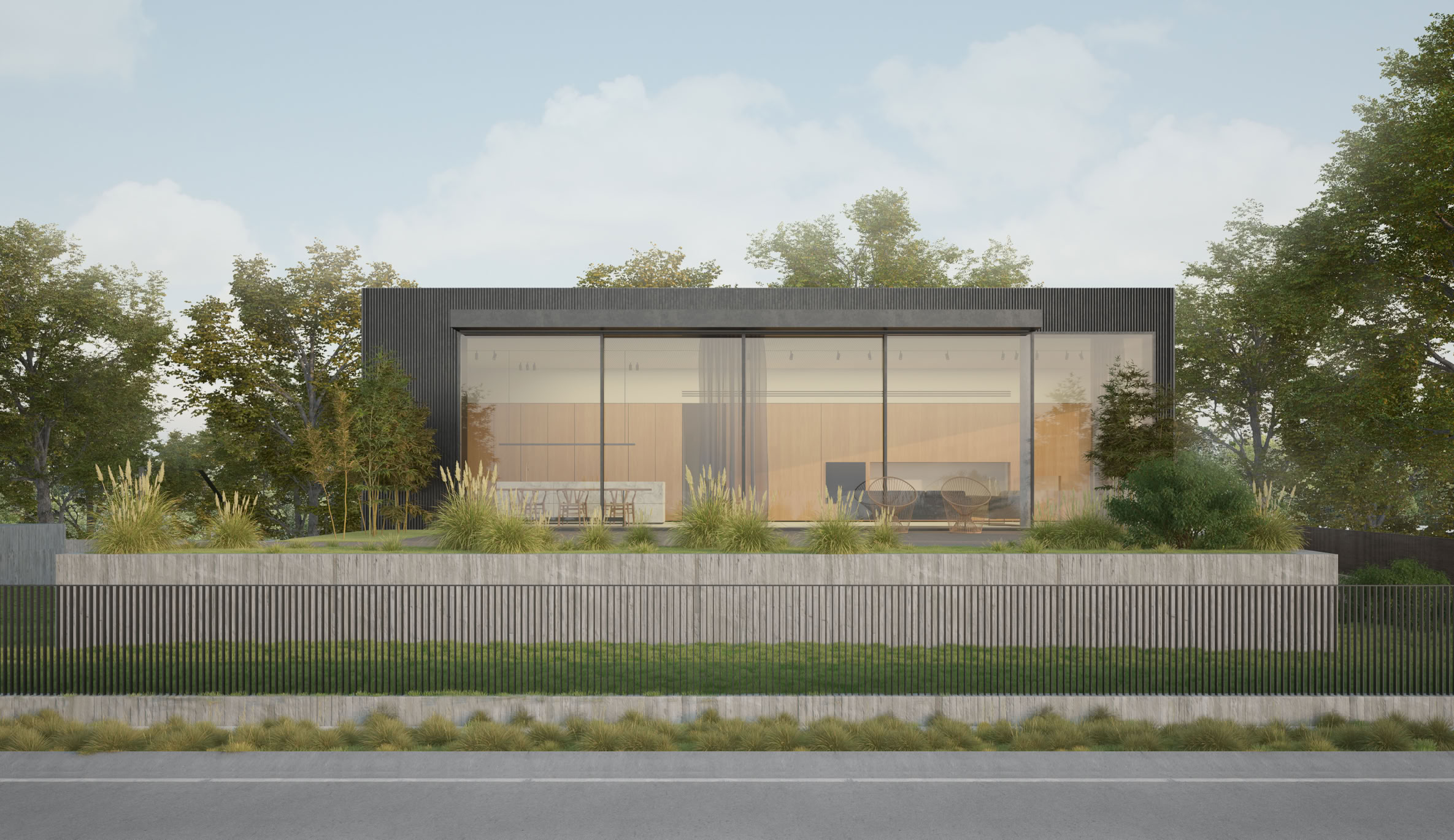 External view of the contemporary riverside house: upper volume clad in metal and exposed concrete base.