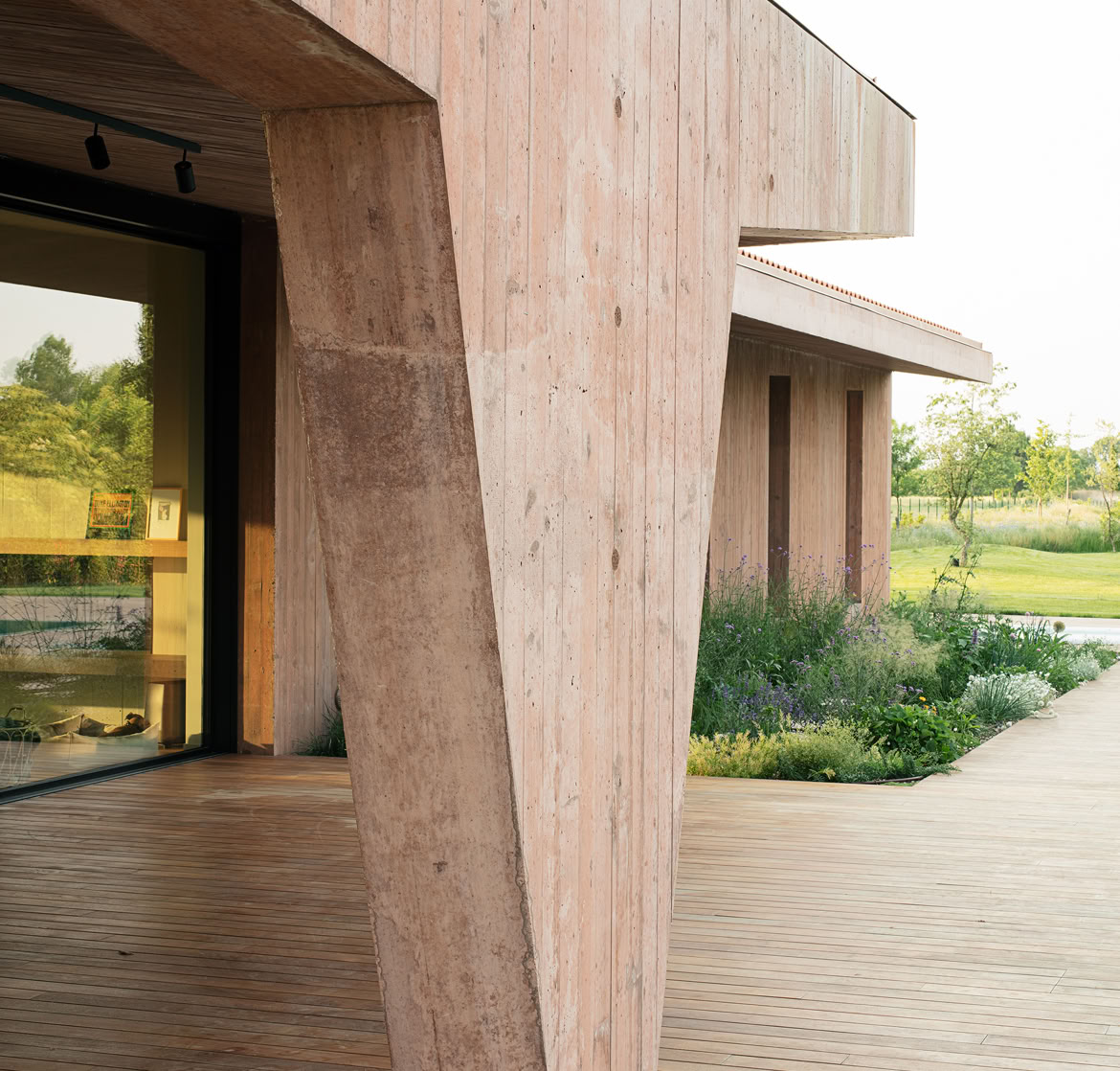 Detail of sculptural pillar creating a year-round usable outdoor porch in a contemporary villa.