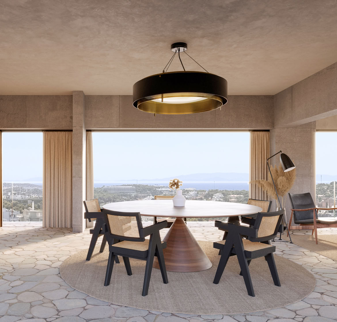 Open-plan living area with integrated kitchen and dining, designed to maximize natural light and connection with the terrace and sea.