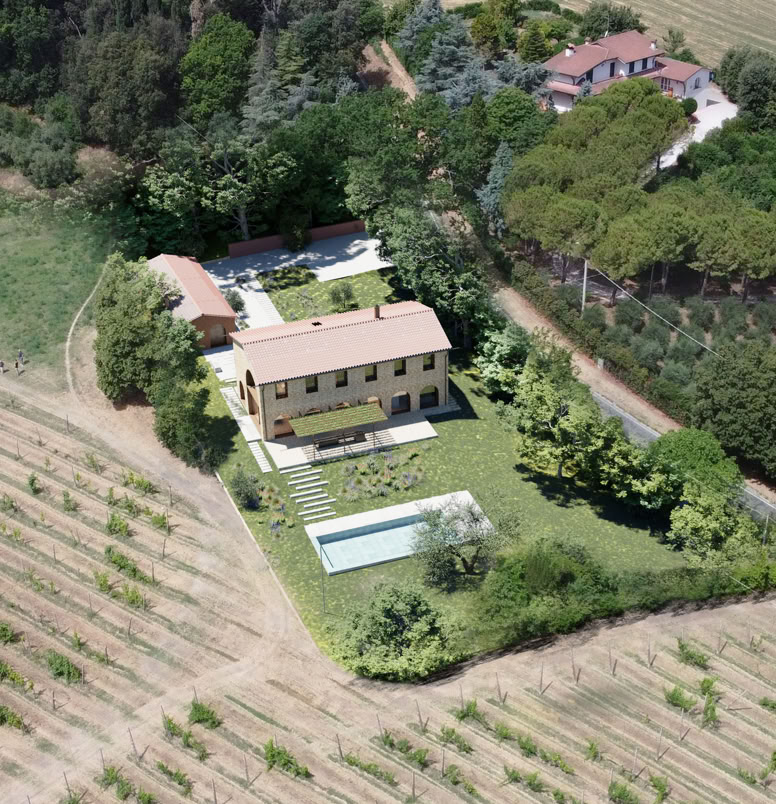 Aerial view of the farmhouse nestled among the Romagna hills.